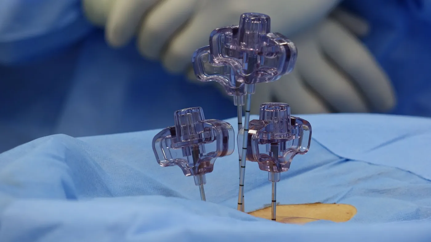 Minimally invasive spine surgery instruments positioned over a surgical drape